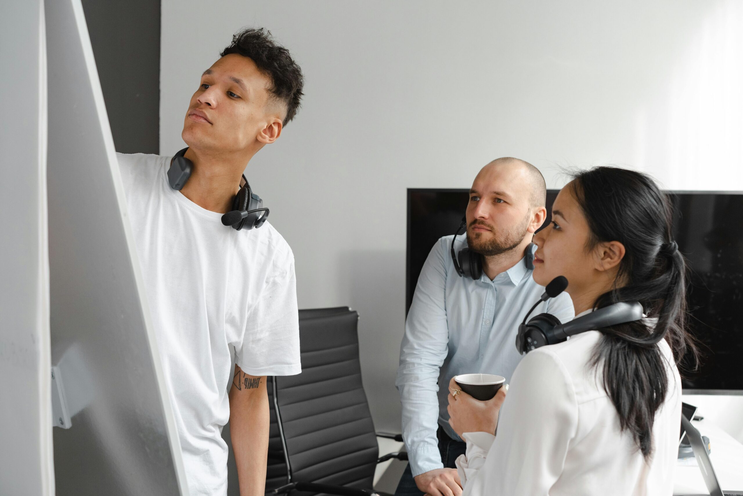 A diverse group of professionals engaged in a dynamic team brainstorming session.